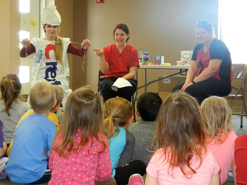 teaching children about brushing teeth and flossing